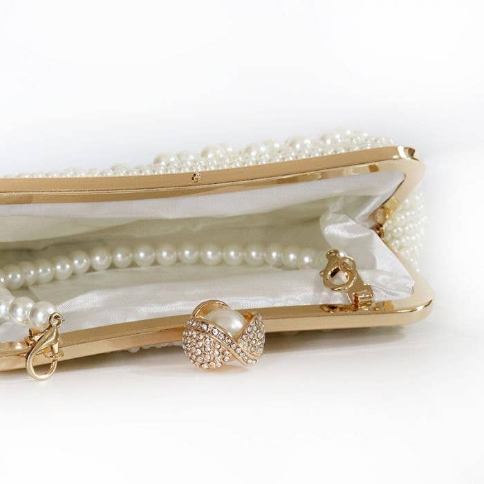 Plain pearl embellished clutch bag with pearl handle