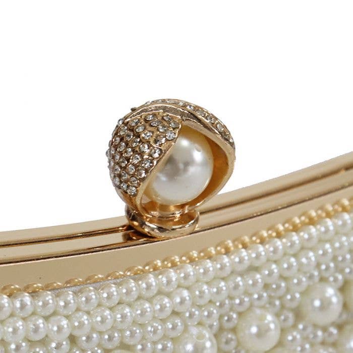 Plain pearl embellished clutch bag with pearl handle