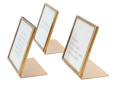 Saying in brass easel frame