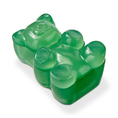 Green gummy bear candy on a white background