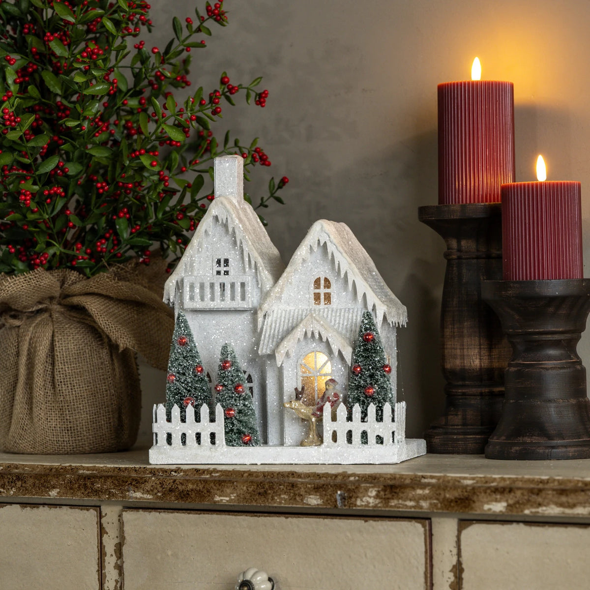 Lighted Snow Covered House with Balcony